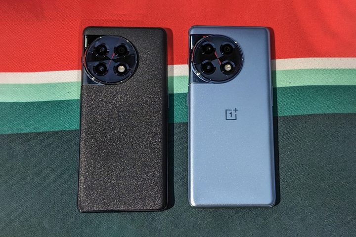 OnePlus 11 in gray and bluish-silver colr on a fabric surface
