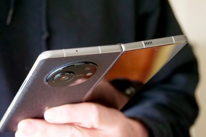 Holding the open Tecno Phantom V Fold.