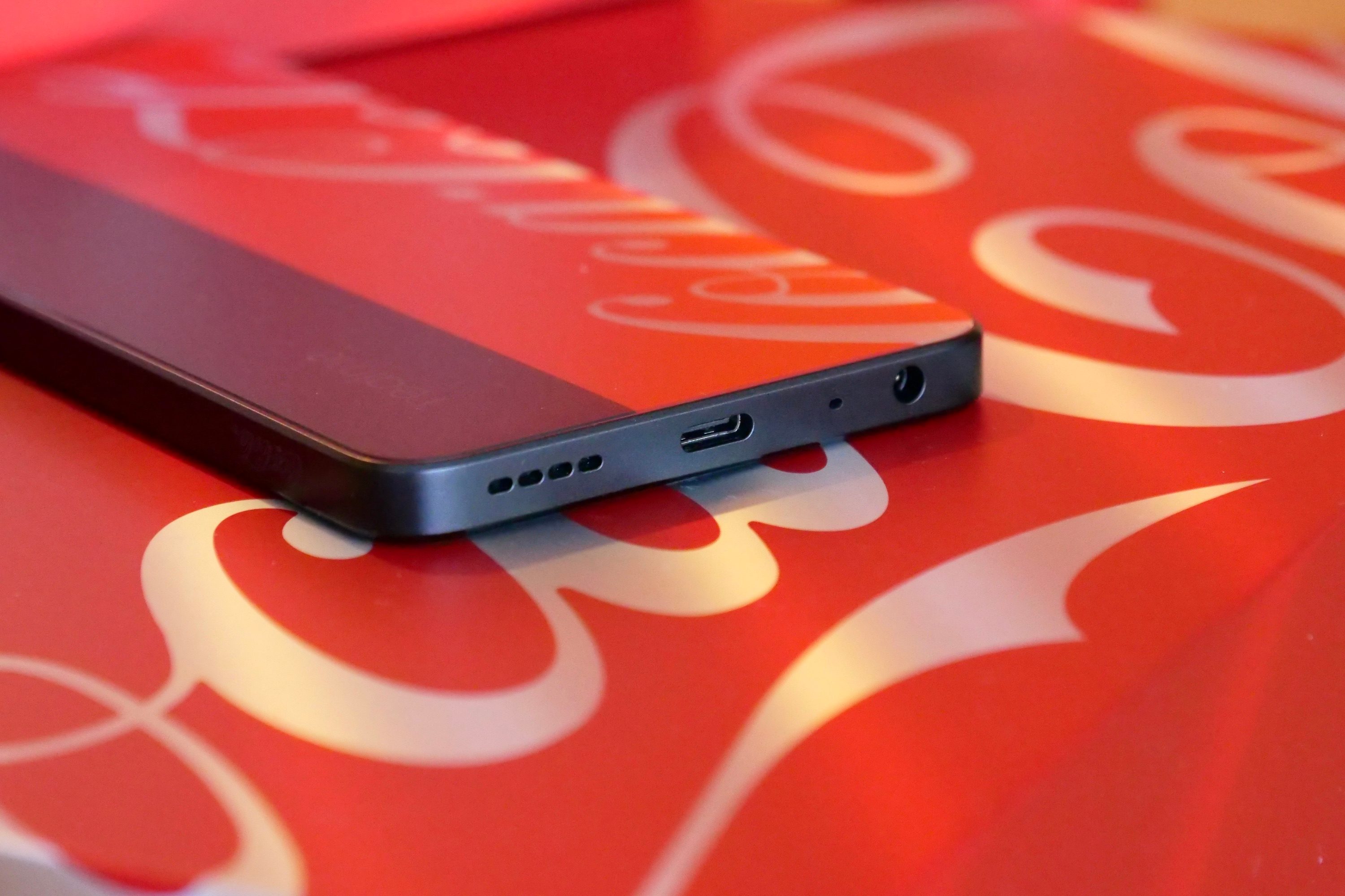 The Realme X Coca-Cola phone's charge port.