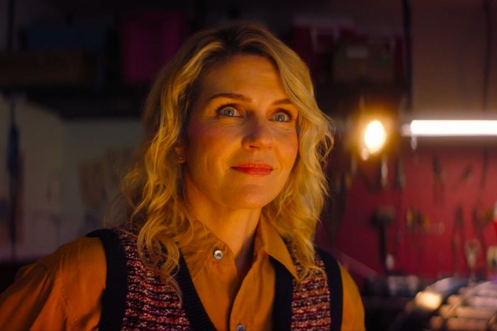 Rhea Seehorn stands in a garage in Linoleum.