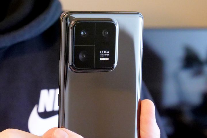 The Xiaomi 13 Pro's camera module, held in a person's hand.