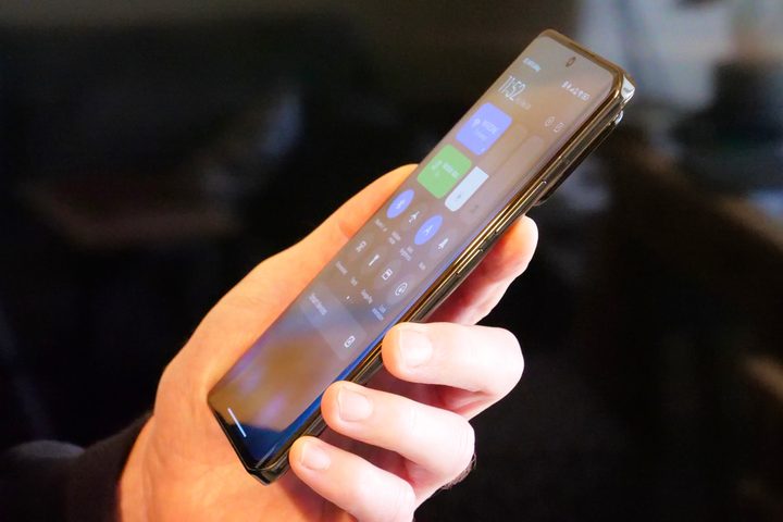 The side of the Xiaomi 13 Pro, held in a person's hand.