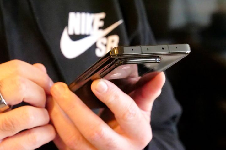 The Xiaomi 13 Pro held in a person's hand.
