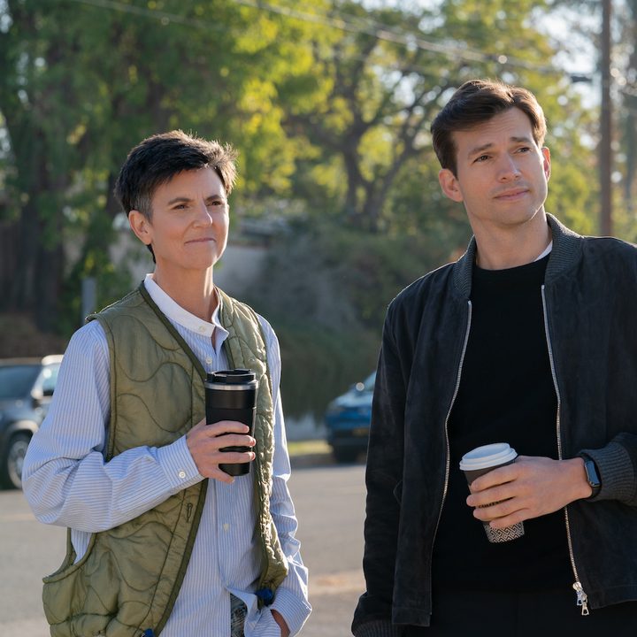 Two people stand next to each other while sipping coffee in Your Place or Mine.