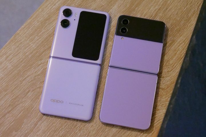 The Samsung Galaxy Z Flip 4 and Oppo Find N2 Flip unfolded and face down on a table.