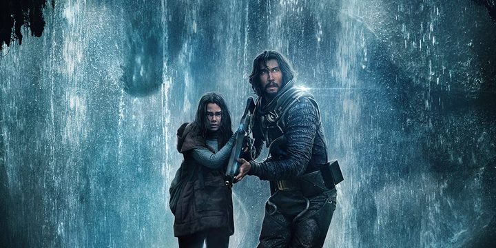 Adam Driver and a child stand in a rainy cave in 65.