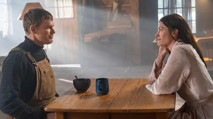 Dexter sitting across from Debra at his kitchen table in a scene from Dexter: New Blood.
