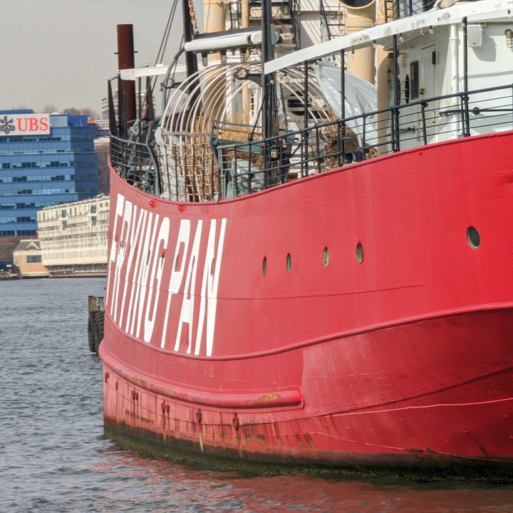 Pixel 7 Pro telephoto picture of a red boat on the water.
