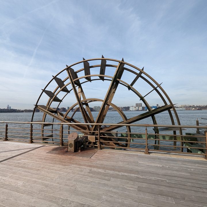 Wide-angle photo from the Pixel 7 Pro, showing a large wheel by a dock.
