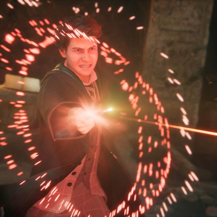A wizard zaps someone off camera with red magic in Hogwarts Legacy,