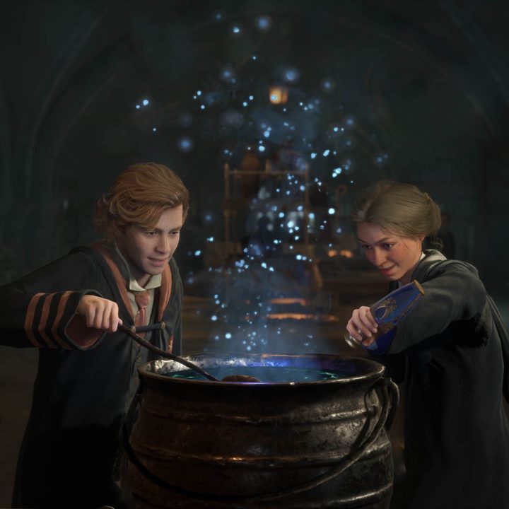 Two students lean over a cauldron in Hogwarts Legacy.