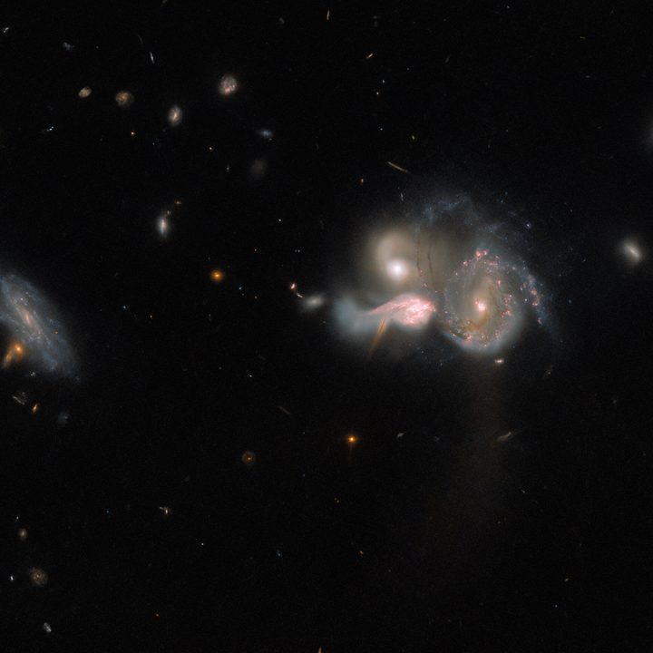 A spectacular trio of merging galaxies in the constellation Boötes takes center stage in this image from the NASA/ESA Hubble Space Telescope.