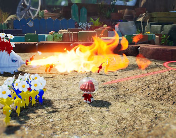 A fire enemy attacks a red Pikmin in Pikmin 4.