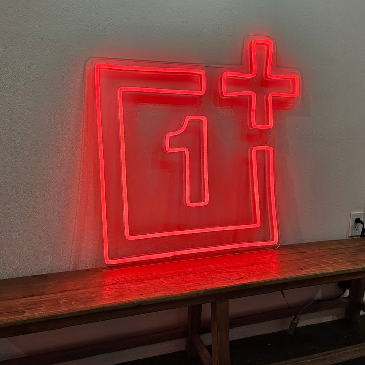 Galaxy S23 Ultra photo of a red neon sign of the OnePlus logo.