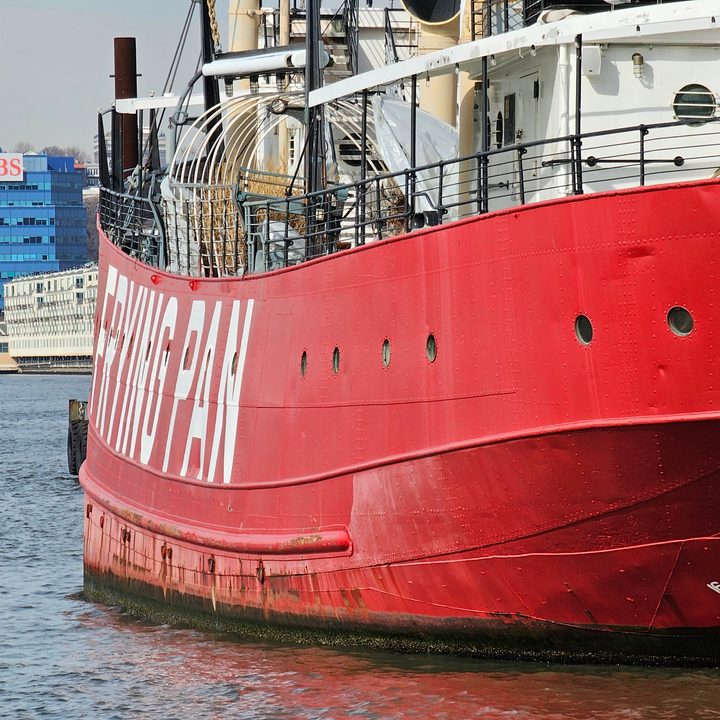 Galaxy S23 Ultra telephoto picture of a red boat on the water.