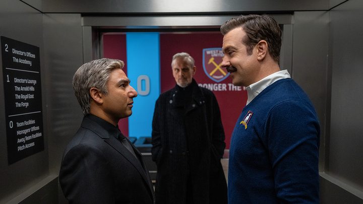 Ted Lasso standing face to face with Nathan in a first look image from Ted Lasso season 3 on Apple TV+.