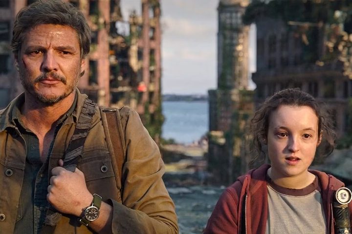 Joel and Ellie look at something in The Last of Us.