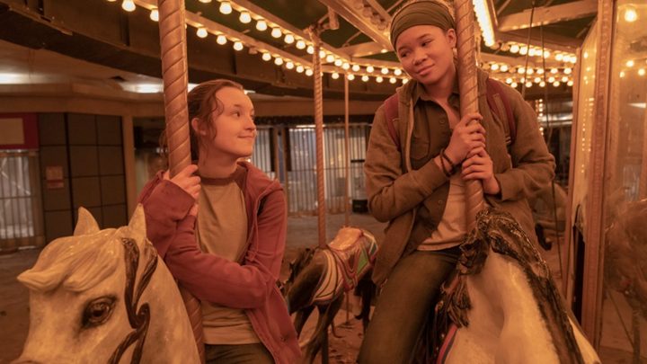 Two girls ride a merry-go-round in The Last of Us.