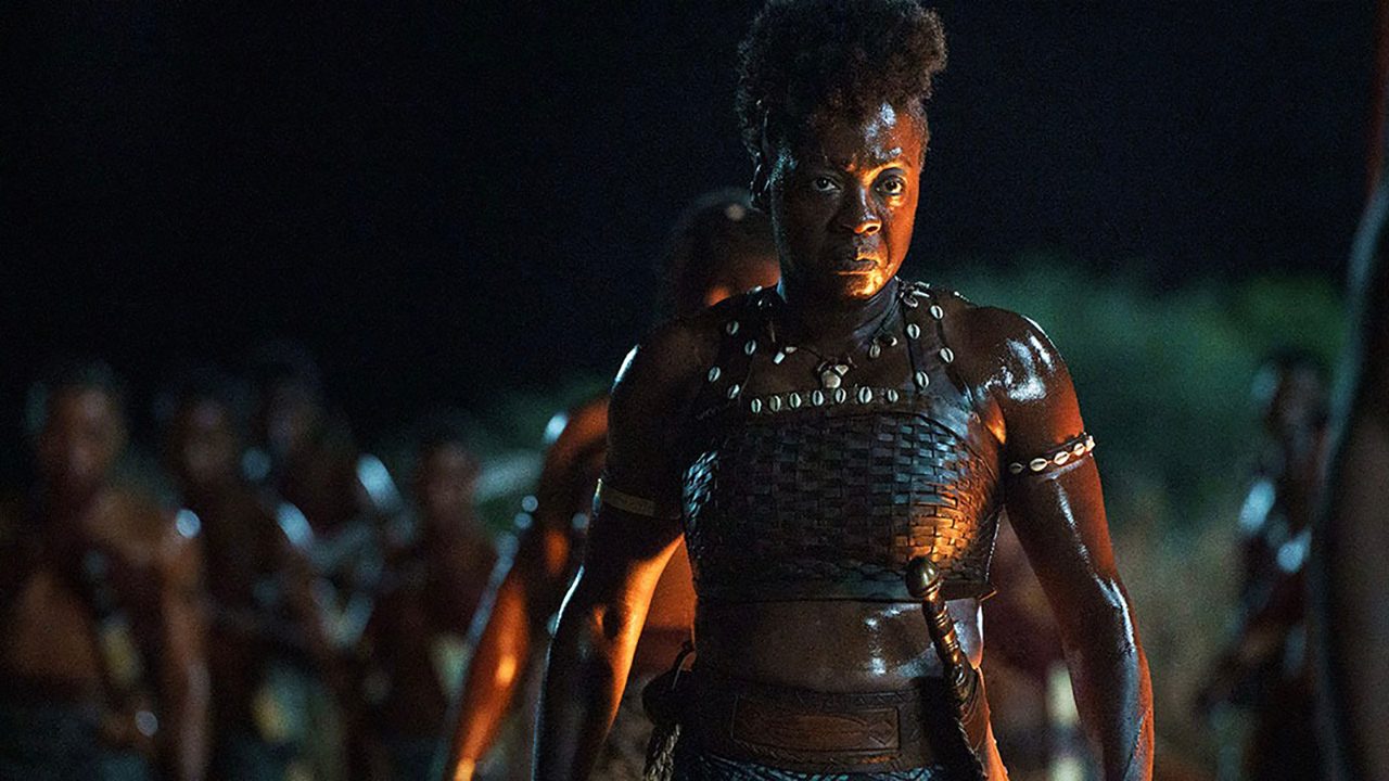 Viola Davis in battle gear, leading an army in a scene from The Woman King.