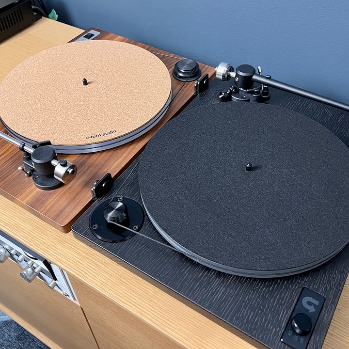 An older U-Turn Orbit Custom turntable next to its newer sibling, the Orbit Theory.