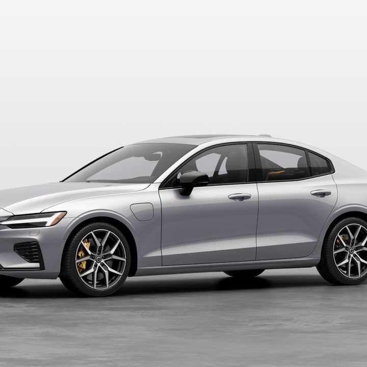 A silver Volvo S60 against a white backdrop.