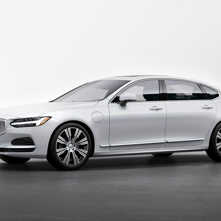 A white Volvo S90 Recharge against a white backdrop.