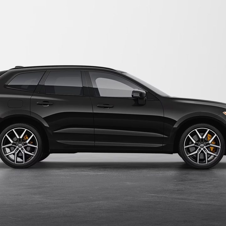 A black Volvo XC60 Recharge plug-in hybrid SUV.