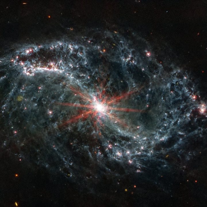 The spiral arms of NGC 7496 are filled with cavernous bubbles and shells overlapping one another in this image from Webb’s Mid-Infrared Instrument (MIRI).