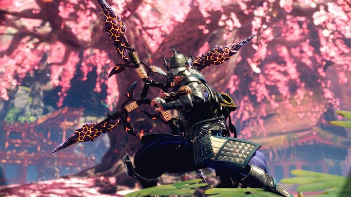 Wild Hearts player in front of cherry blossom tree.