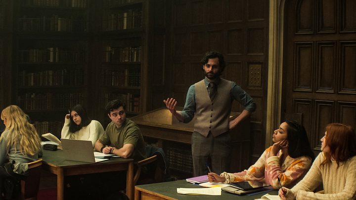 Joe teaching a class in season 4 of You.