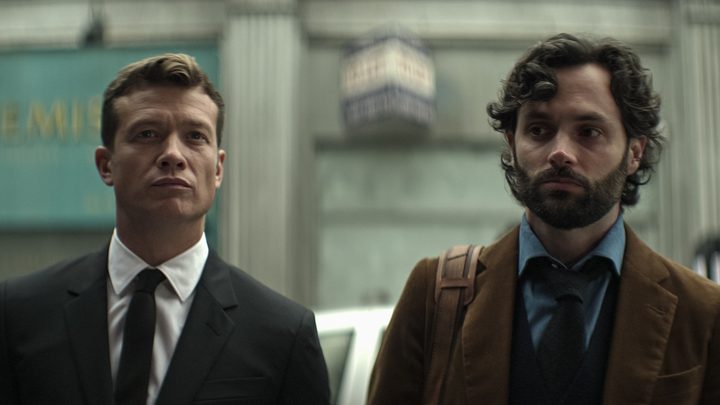 Rhys and Joe stand side by side outside in a scene from You season 4.