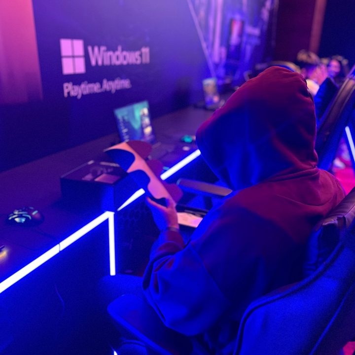 Gamer wearing dak colored hoodie captured by iPhone 14 Pro portrait mode.
