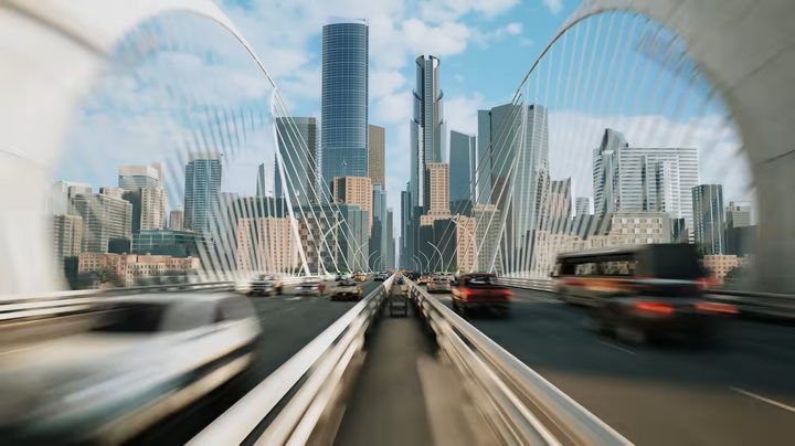 A bridge leading into a city.