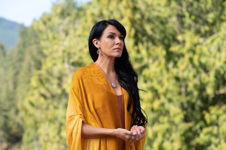 Adult Lottie wears a gold dress in Yellowjackets Season 2.
