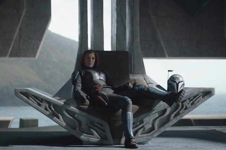 Bo-Katan sits on a throne in The Mandalorian Season 3 Episode 1.