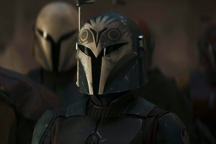 Bo-Katan stands with several other Mandalorians in The Mandalorian season 3 episode 3.