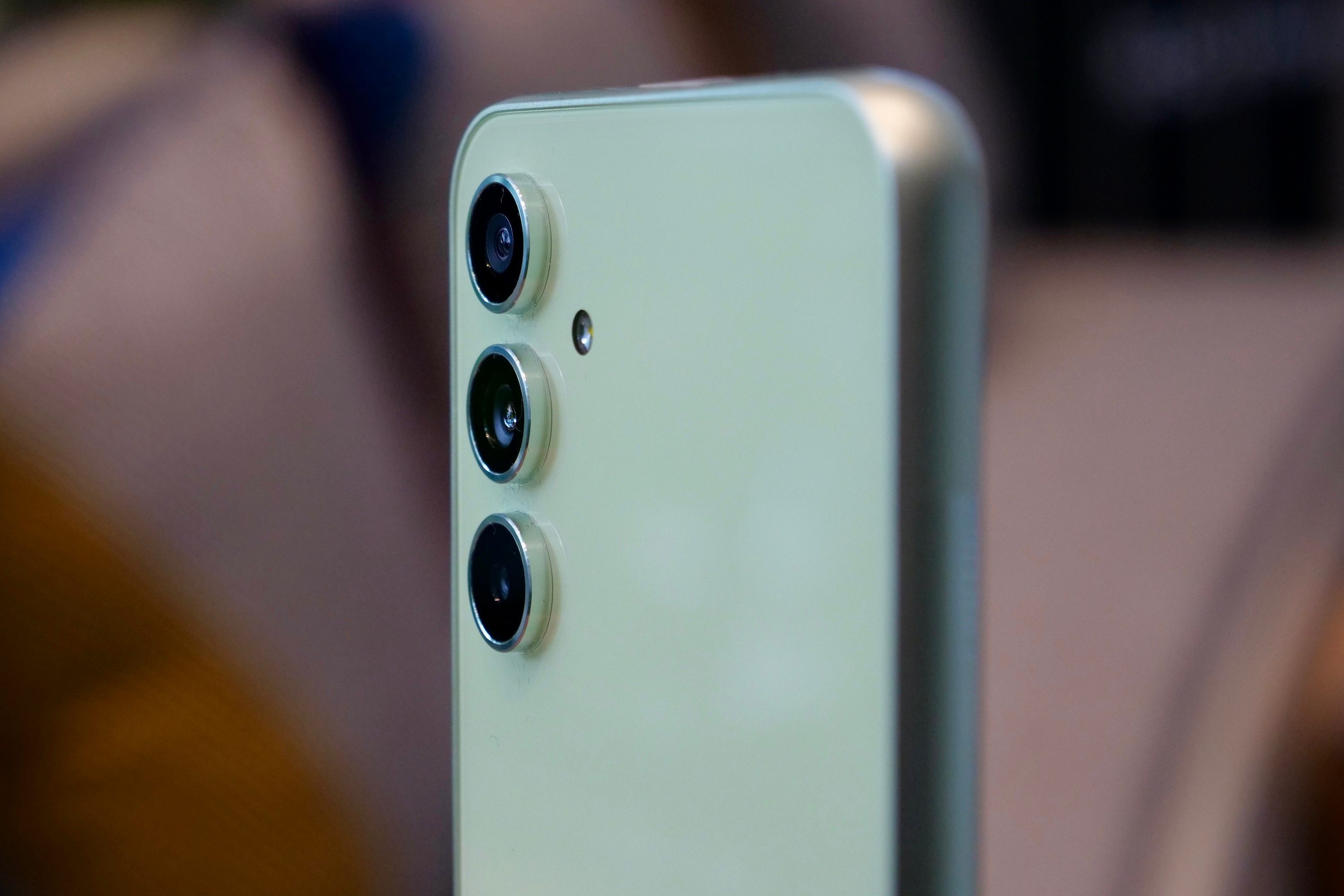 The metal decorative rings around the Galaxy A54's cameras.