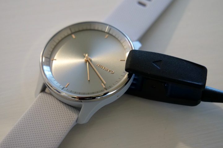 The Garmin Vivomove Trend on charge using the included charger.