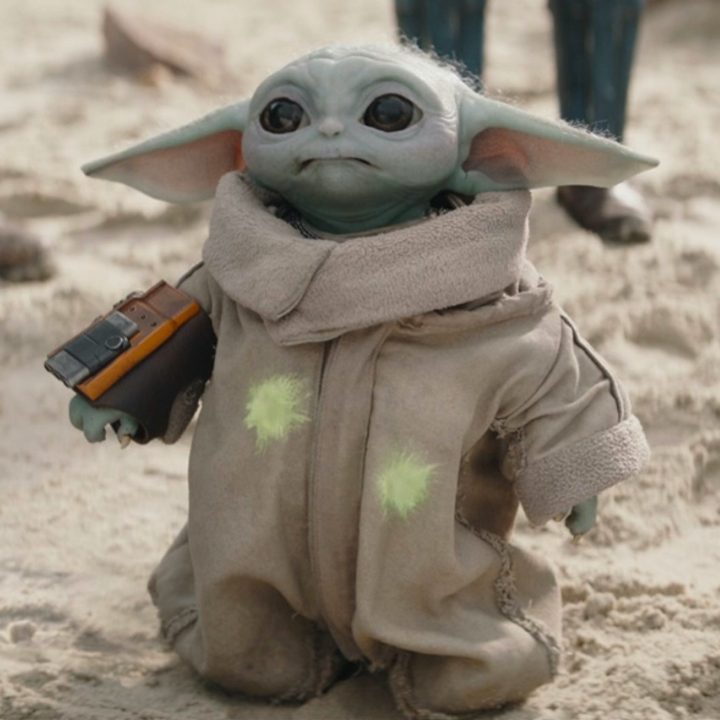 Grogu standing in the sand from an episode of The Mandalorian.