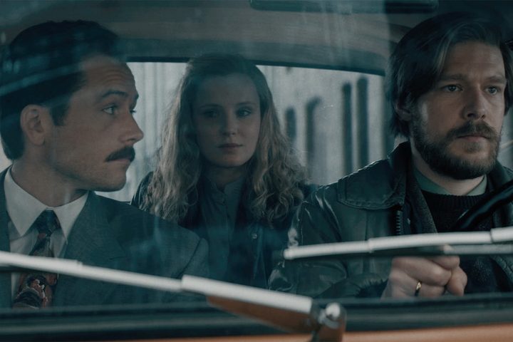Henk, Sasha, and Alexey sit in a car together in Tetris.