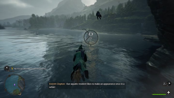 A wizard flying on a broom over a lake.