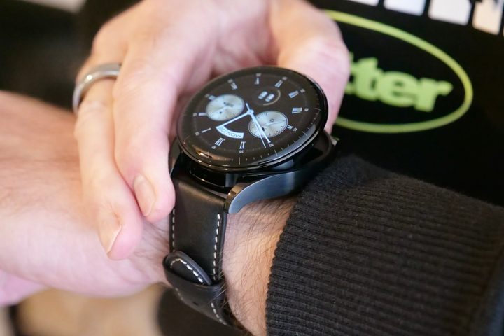 Opening the Huawei Watch Buds's top.