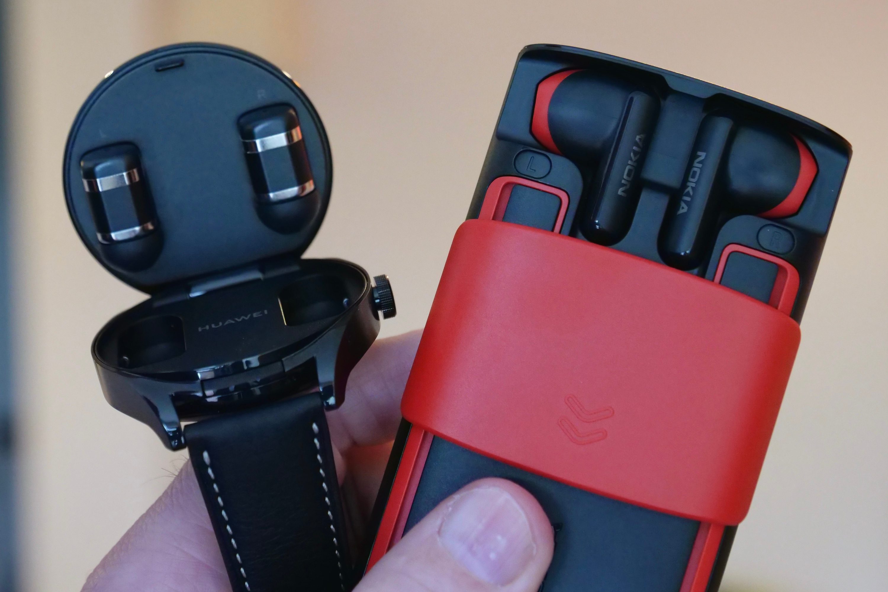 The open Nokia 5710 XpressAudio and Huawei Watch Buds