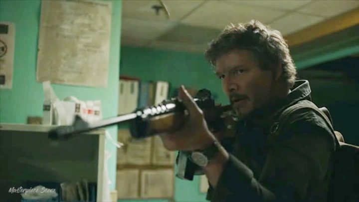Joel holds a rifle in The Last of Us.