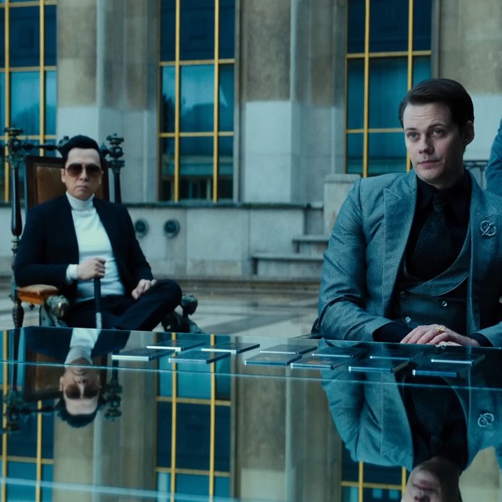 The Marquis and Caine sitting at a table in "John Wick: Chapter 4."