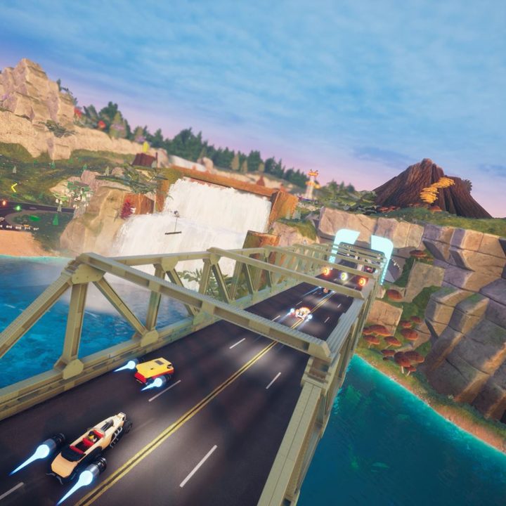 Lego cars race down a bridge in Lego 2K Drive.