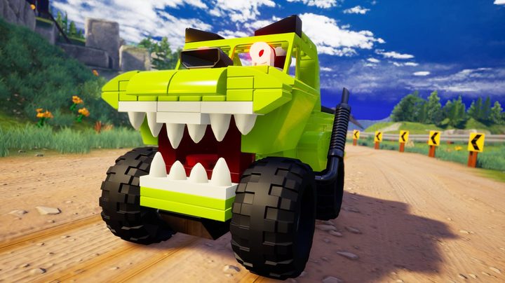 A custom car built drives around Lego 2K Drive.