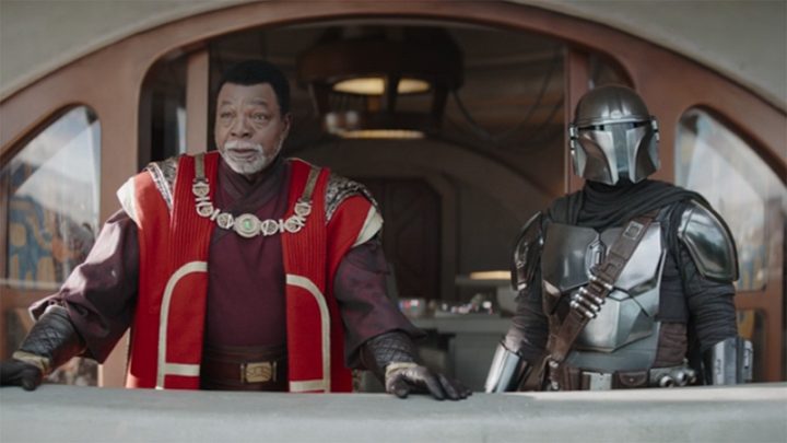 Din and Greef stand in The Mandalorian.