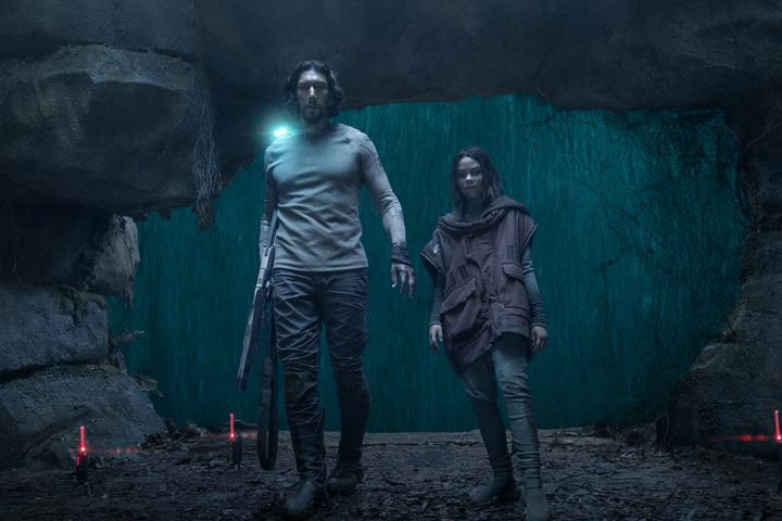 Mills and Koa stand in a cave together in 65.