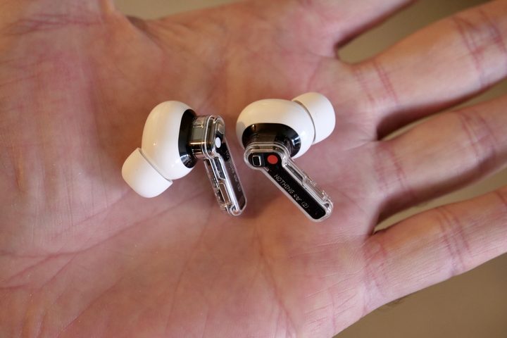 The Nothing Ear 2 earbuds in a person's hand.